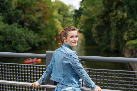 Young Woman Turning Back To Smile At The Camera