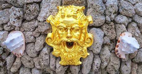 Golden allegorical mask of the sea god Neptune (Poseidon)
