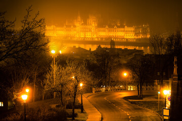 Hungarian parliament at Danube river seen across the fog. Budapest 