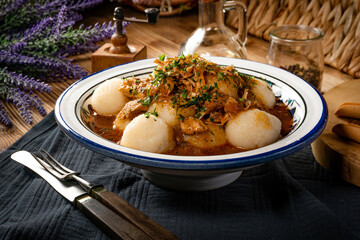 Dumplings with turkey and chorizo sauce.