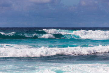 Fototapeta na wymiar Choppy surf in stormy weather, Sunset Beach, Oahu, Hawaii