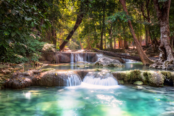 Fototapeta premium Erawan Waterfall is a beautiful waterfall in spring forest in Kanchanaburi province, Thailand.