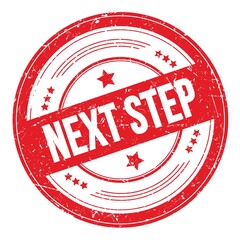 NEXT STEP text on red round grungy stamp.
