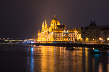 Fototapeta na wymiar Side view of Hungarian Parliament illuminated at night in Budapest