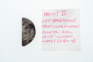 Silver short cross cut half penny English hammered coin of King Henry II of the 12th century dated around 1180- 1189  minted in London England isolated on a white background, stock photo image