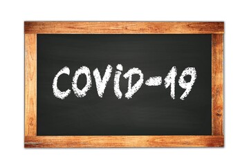 COVID-19 text written on wooden frame school blackboard.