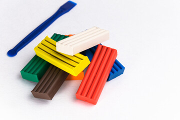 multicolored plasticine on a white background