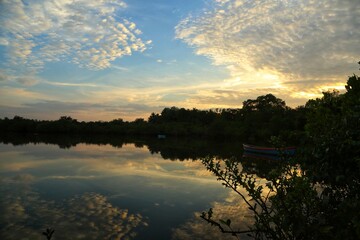 Boat on the lake with beautiful clouds