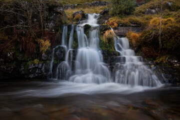 Fototapeta na wymiar A waterfall from a tributary of The River Tawe not far from its source in the Brecon Beacons, South Wales, UK. 