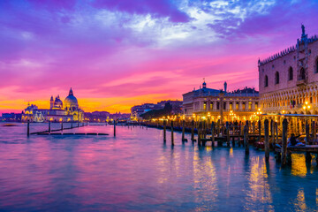Beautiful sunset in Venice with San Marco Square and Santa Maria della Salute cathedral in the background