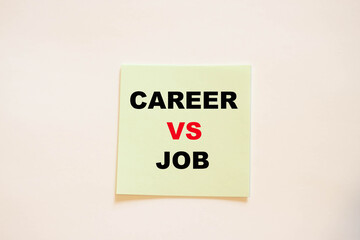 Square paper with the words - career versus work.