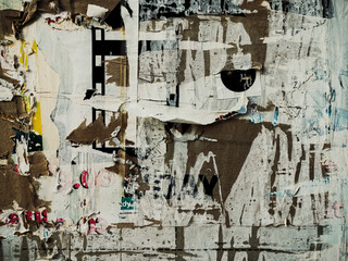 Fototapeta premium Layers of old colorful posters on wall damaged by time for your grunge style design