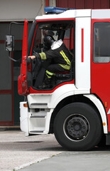 Fototapeta premium Rome, RM, Italy - May 30, 2019: fireman quickly gets out of the