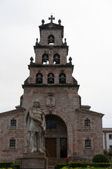 Fototapeta na wymiar old Spanish church with many bells. The facade is shaped like a staircase