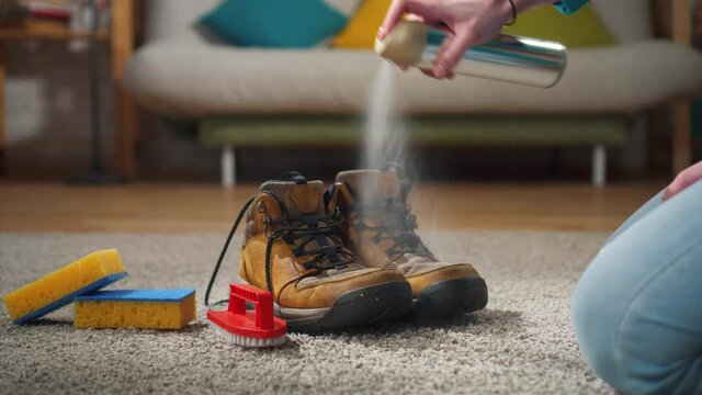 spraying shoes with a protective moisture-proof spray