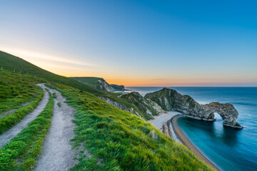 Durdle Door at sunrise in Dorset, Jurassic Coast, England, UK