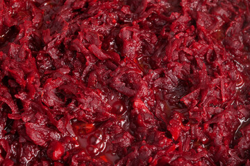 Texture of fried or stewed beetroot, close-up, top view. Food background