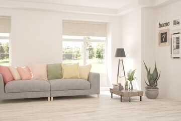 White living room with sofa and summer landscape in window. Scandinavian interior design. 3D illustration