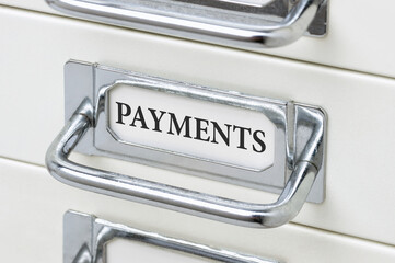 A drawer cabinet with the label Payments