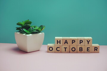 Happy October alphabet letter on blue and pink background