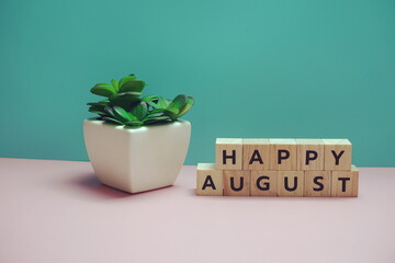 Happy August alphabet letter on blue and pink background