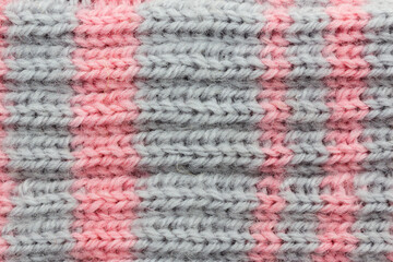 Close-up of a canvas knitted in two colors, background.