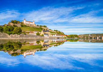 Fototapeta na wymiar Marienberg Fortress with reflection of the city in Main River. Wurzburg city in Germany