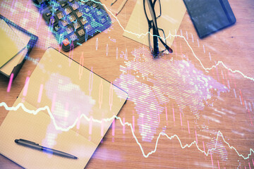 Double exposure of forex graph drawing and work table top veiw. Concept of financial analysis.