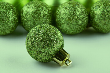 Christmas background in olive color. Christmas toys. Place for text