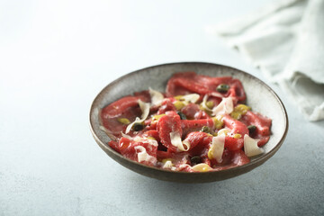 Traditional homemade beef carpaccio with capers