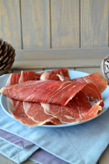 Carpaccio slices of raw marbled beef, vertical