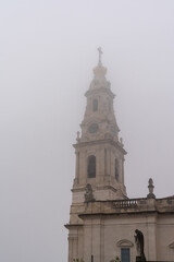 Fototapeta na wymiar view of the sanctuary of Our Lady of Fatima in Portugal on a foggy day
