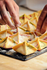 Chef cook creating composition with ravioli.