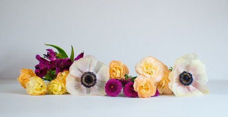 Panorama with bouquet of spring flowers. Mock up frame and colorful flowers. Empty space, mock up for presentation design, modern art. Space for text. 