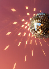 Mirror disco ball sun glare abstract pink background, banner, frame, postcard. Disco festive new...