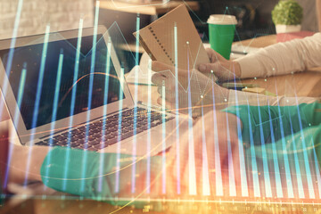 Double exposure of man and woman working together and forex chart hologram. Business concept. Computer background.