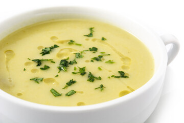 Fresh green asparagus soup isolated on white background