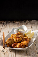 Spicy chicken karaage on wooden table