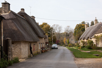 Fototapeta na wymiar A quiet rural street in Minster Lovell, Oxfordshire in the UK