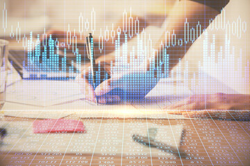 Multi exposure of woman hands typing on computer and financial chart hologram drawing. Stock market analysis concept.