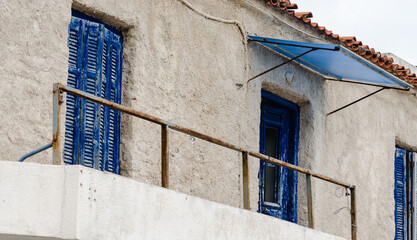 Entrance door to the terrace of an abandoned house in Epidos on the island of Evia, Greece 