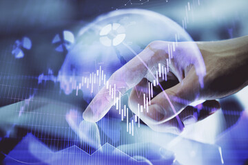 Multi exposure of man's hands holding and using a digital phone and forex graph drawing. Financial market concept.