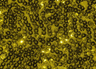 Yellow sparkling sequins texture background, copy space. Illuminating. Color of the year 2021. Top view, flat lay