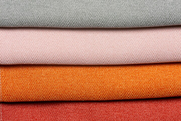 Various colors in a set of comparison interior decoration sample swaps of textured curtain fabric with various shades and colorful backdrop evenly lit