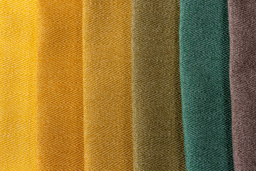 Color scheme of home interior decoration sample swaps of textured curtain fabric from golden yellow...