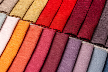 Closeup of a set of comparison interior decoration sample swaps of textured curtain fabric with...