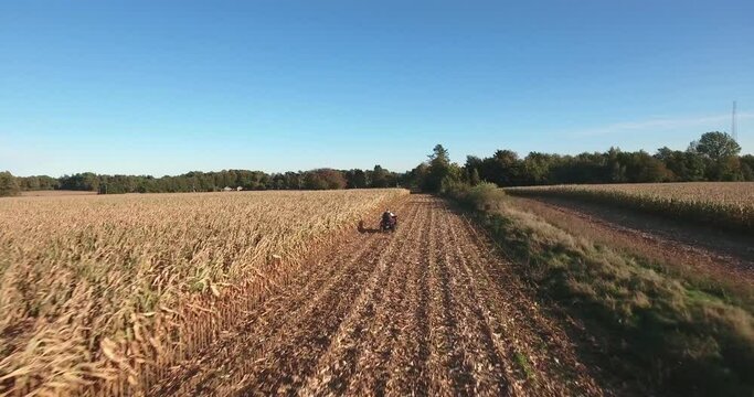 Quad Bike Driving Fast on a Field in South Sweden Sk&aring;ne in Borrby &Ouml;sterlen, Aerial Following