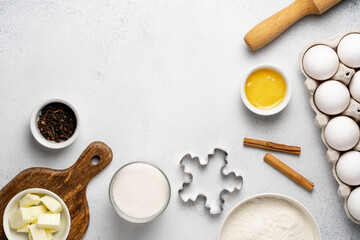 Flat lay with baking ingredients for gingerbread. Wheat flour, sugar, rolling pin, butter, honey,...