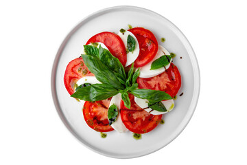 Delicious italian caprese salad with ripe tomatoes, fresh garden basil and mozzarella cheese. Vegetarian, dietary, nutritious meal.