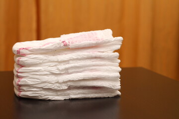 white baby diapers with a pink stripe. side view